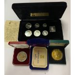 A group of mixed medals and coins.