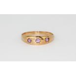 A rose gold amethyst set ring, (P.5).