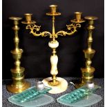 A gilt metal and brass candelabrum, brass candle sticks together with an interesting pair of