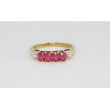 A 9ct yellow gold ruby and diamond set ring, (N).