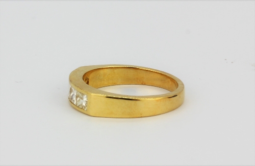 An 18ct yellow gold ring set with four princess cut diamonds, approx. 0.80ct overall, (L.5). - Image 2 of 2