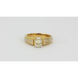 An 18ct yellow gold solitaire ring set with a brilliant cut diamond, approx. 0.60ct, (M).