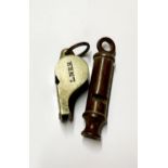 A dated 1914 J Hudson & Co police whistle together with a L.N.E.R railway ACME thunderer guards