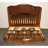 An 1940's oak cased silver plated cutlery set.