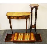 A mahogany veneered hall table, a mahogany plant stand and a large wooden backgammon board.