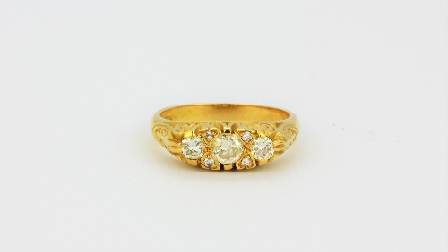 An 18ct yellow gold ring set with brilliant cut diamonds, approx. 0.68ct, (O).