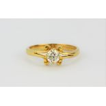 An 18ct yellow gold solitaire ring set with a brilliant cut diamond, approx. 0.40ct, (L.5).