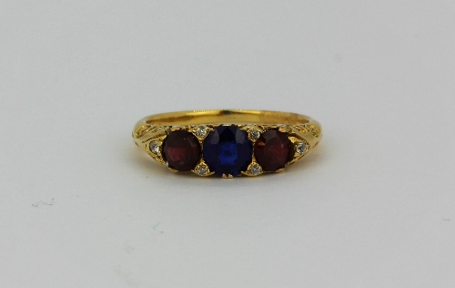 An 18ct yellow gold (stamped 18) ring set with diamonds and other stones, (K).