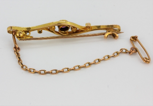 A boxed antique yellow metal (tested minimum 9ct gold) pink tourmaline and seed pearl set brooch, L. - Image 2 of 3