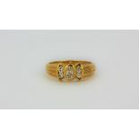 A 9ct yellow gold ring set with an oval cut diamond and diamond set shoulders, approx. 0.50ct