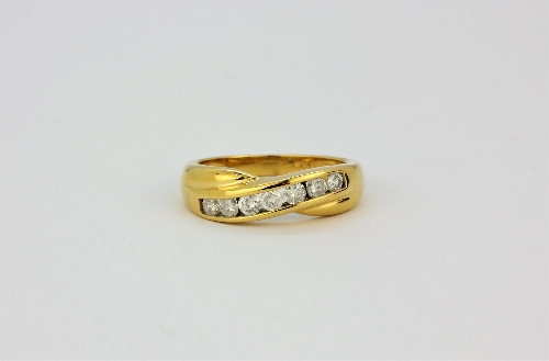 An 18ct yellow gold crossover ring set with brilliant cut diamonds, approx. 0.5ct overall, (P).