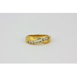 An 18ct yellow gold crossover ring set with brilliant cut diamonds, approx. 0.5ct overall, (P).