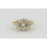 An 18ct yellow gold ring set with brilliant and baguette cut diamonds, approx. 1ct overall, (L).