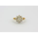 An 18ct yellow gold diamond set cluster ring, approx. 1ct overall, (N).