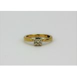 A 9ct yellow and white gold solitaire ring set with a brilliant cut diamond, approx. 0.35ct, (J).