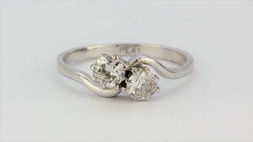 A platinum diamond set crossover ring, approx. 0.60ct, (N).