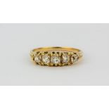 An 18ct yellow gold (stamped 18ct) set with old cut diamonds, approx. 1.25ct, (S).