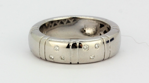 A white metal (tested 18ct gold) diamond set ring, (N).