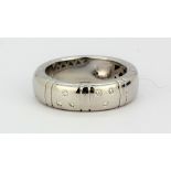 A white metal (tested 18ct gold) diamond set ring, (N).