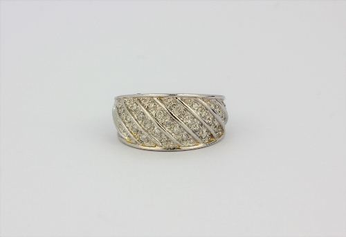 A 9ct white gold diamond pave set ring, (O).