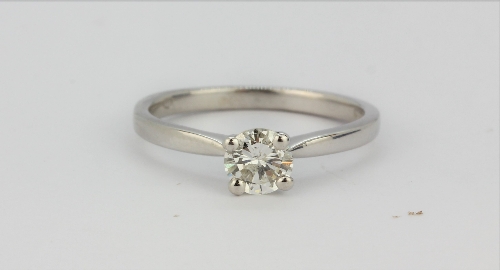 An 18ct white gold solitaire ring set with a brilliant cut diamond, approx. 0.23ct, (M).