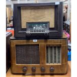 A wooden cased Philips radio model 680A/15 together with a further wooden cased Philco radio.