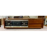 A Rigonda Symphony stereo-radio phonograph, 43.5cm x 11.5cm x 13cm.