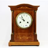 An Edwardian inlaid mahogany striking mantel clock, H. 34cm.