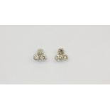 A pair of white gold (tested 18ct gold) earrings set with brilliant cut diamonds, approx. 1.1ct,
