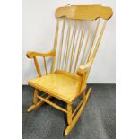 A wooden rocking chair.