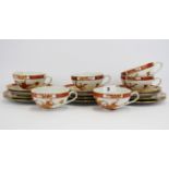 A set of six Japanese tea cups, saucers and side plates.