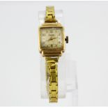 A lady's Rotary 9ct yellow gold wrist watch on a gilt strap.