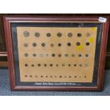 A framed collection of mixed Roman bronze coins.