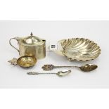 A hallmarked silver shell dish, silver mustard pot (no liner), two silver spoons and a French silver