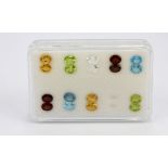 A box containing nine pairs of unmounted gemstones : blue topaz, peridot, garnet, citrine and