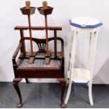 A piano stool, painted plant stand and processional candle holders on stand.