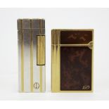 A Dupont pocket lighter and a Dunhill pocket lighter.