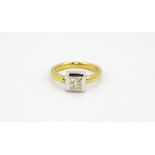 An 18ct yellow gold and platinum solitaire ring set with an approx. 0.75ct princess cut diamond, (