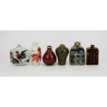 A group of six mixed Chinese porcelain and other snuff bottles.