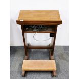 An ecclesiastical 1950's mahogany prayer lectern and kneeler, H. 81cm.