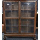 A 1930's oak bookcase, 88cm x 109cm.