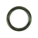 A fine spinach jade bangle, Dia. 9mm. Internal Dia. 5.8cm.