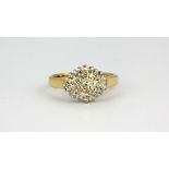 A 9ct yellow gold diamond set cluster ring, approx. 3.3gr, (L).