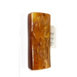 An unusual Tibetan carved yak bone erotic amulet, L. 9cm.