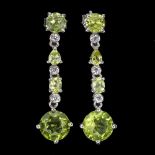 A pair of 925 silver drop earrings set with round and oval cut peridots and white stones, L. 3.5cm.