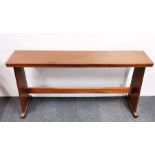An ecclesiastical 1950's mahogany long table 137cm x 30cm x 64cm.