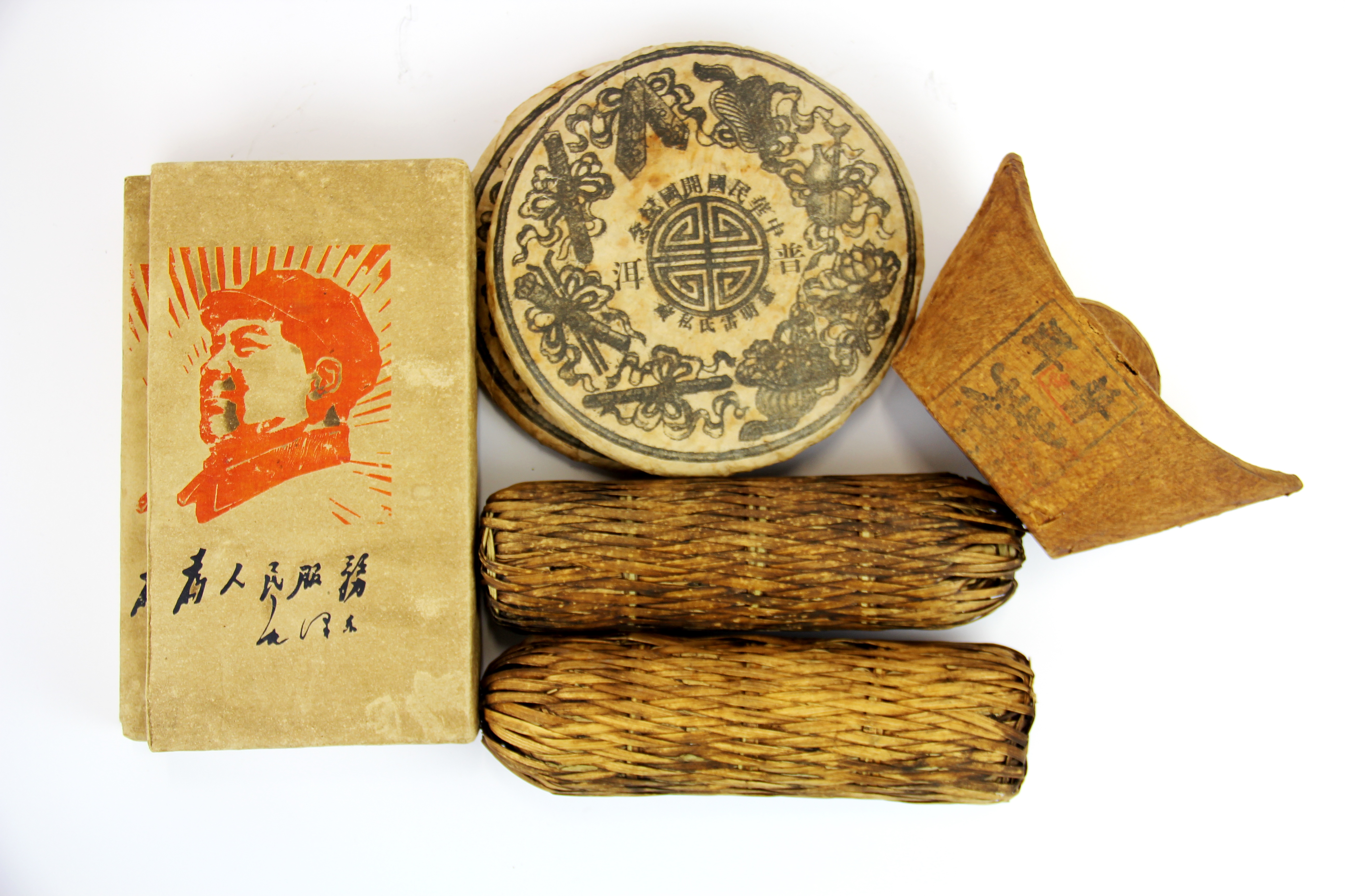 A group of seven vintage Chinese tea blocks, largest 13cm x 24cm x 3cm.