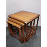 A nest of three G-plan teak coffee tables, largest 50cm x 50 cm x 51cm.