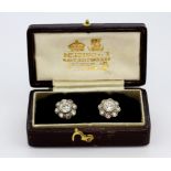 A pair of boxed yellow and white metal (tested high carat gold) cluster earrings set with