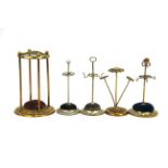 A group of five hat pin stands, tallest. 14cm.